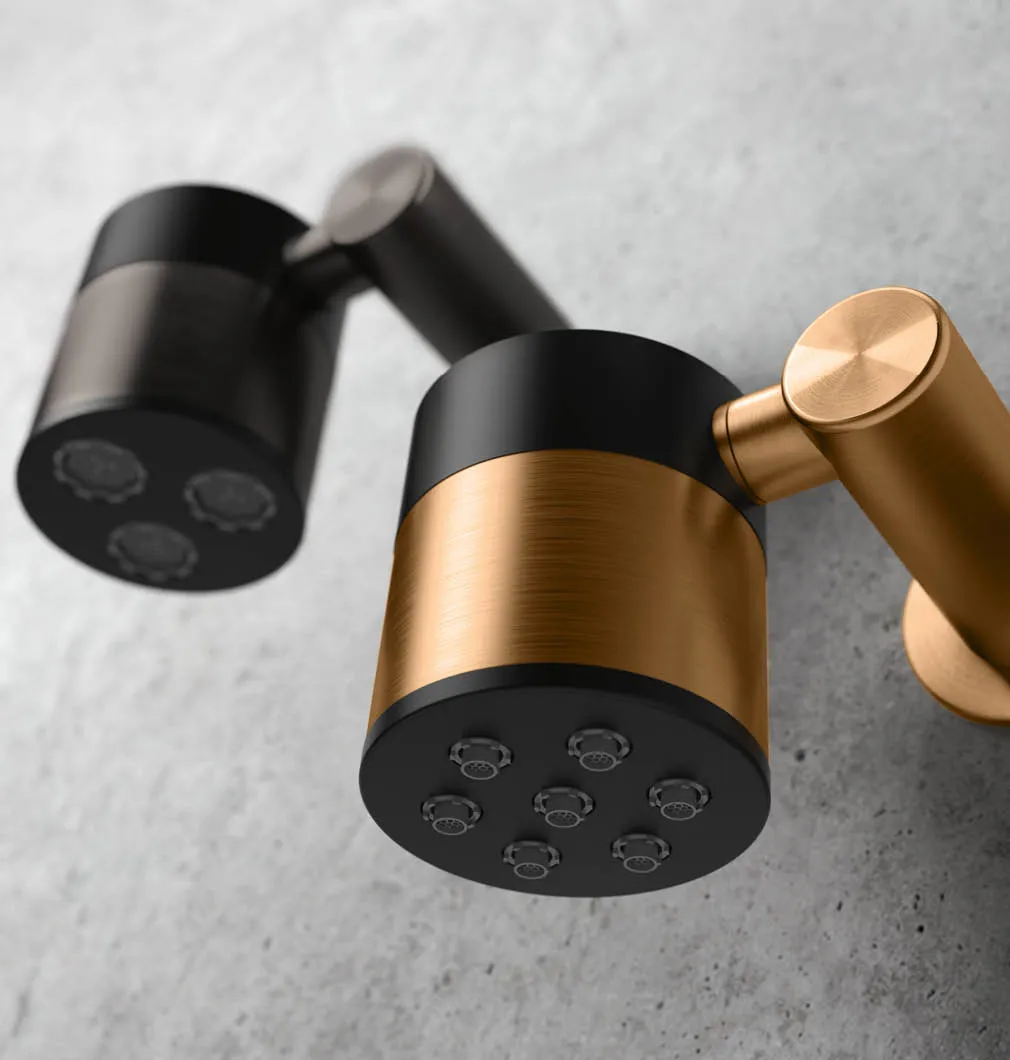 Ø 70 mm shower head with 3 rain function aerators and swivel shower arm, brushed carbon PVD - SWN4  Ø 70 mm shower head with 7 soft-flow nozzles and swivel shower arm, brushed bronze PVD - SWN3