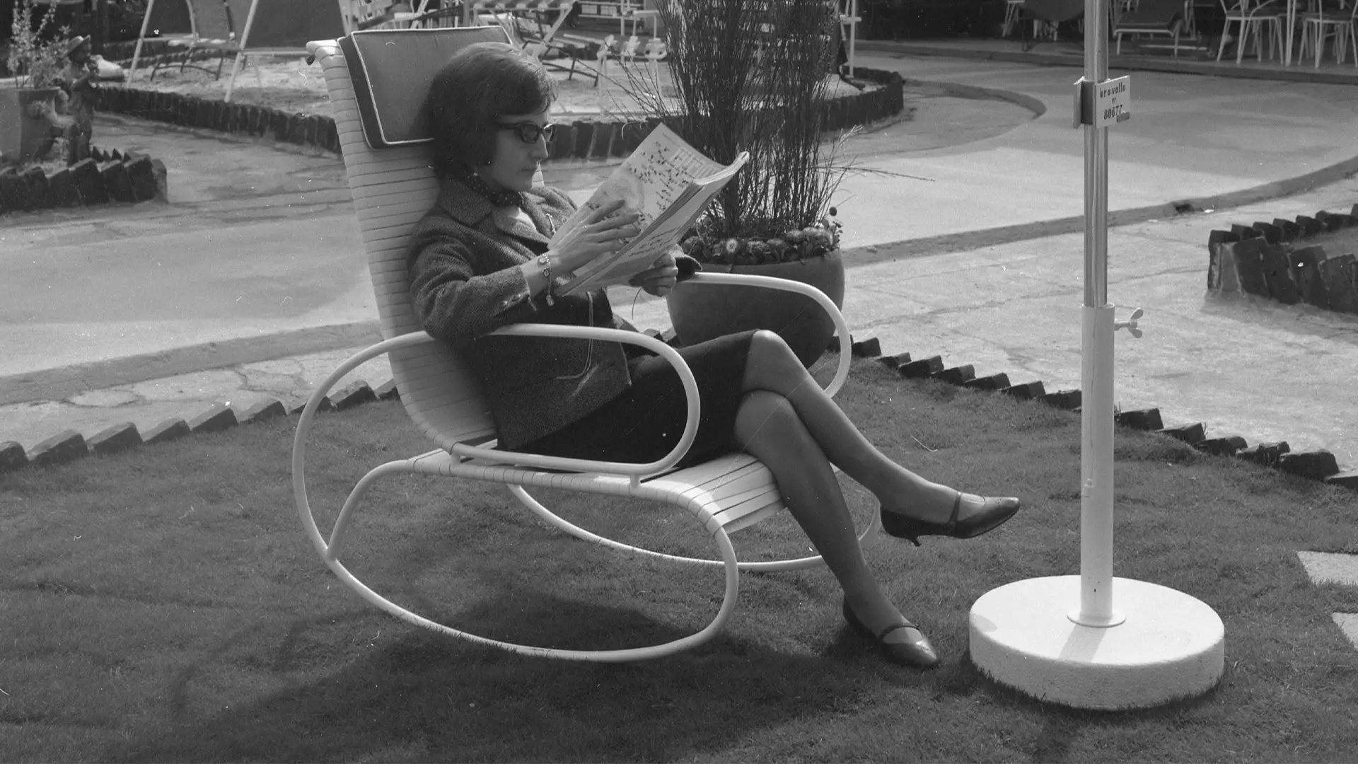 woman sitting, black and white photo, archive