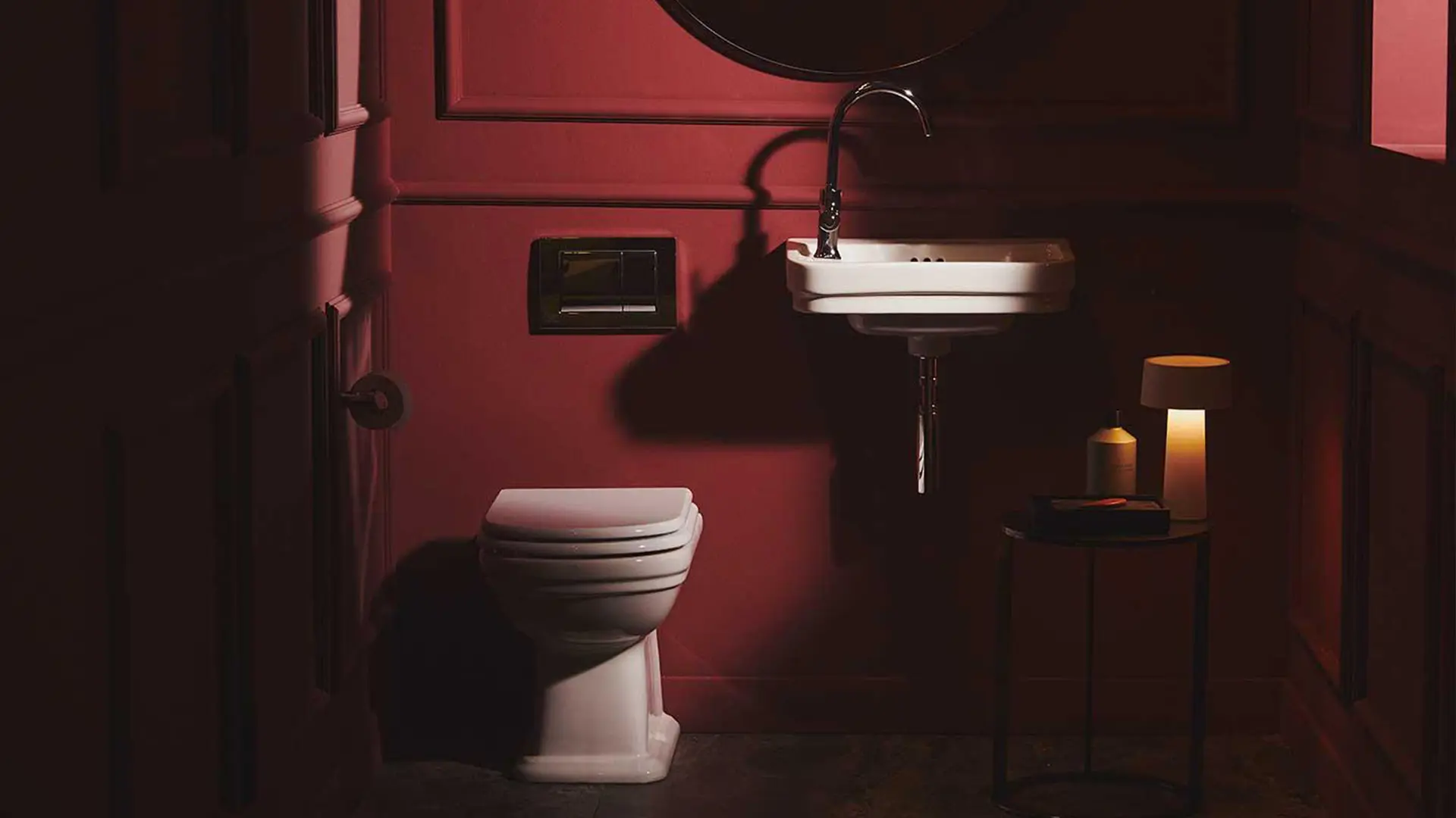 Calla washbasin and Joy Neo mixer by Ideal Standard in a red room.